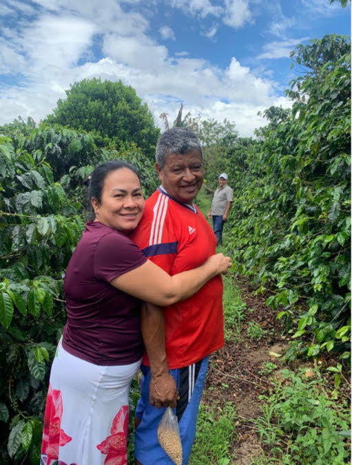 Coffee farmer Carlos Martinez with family on his farm in Huila Colombia