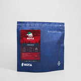Kota coffee package with red label on a white background